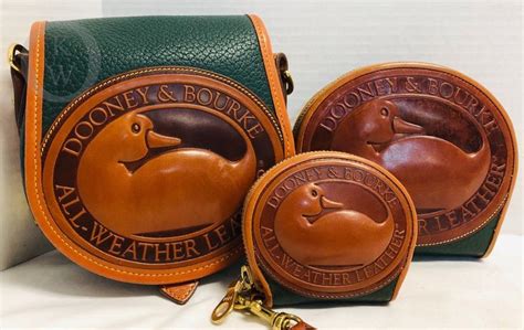 dooney and bourke green duck charm fake or real|Dooney & Bourke handbags real.